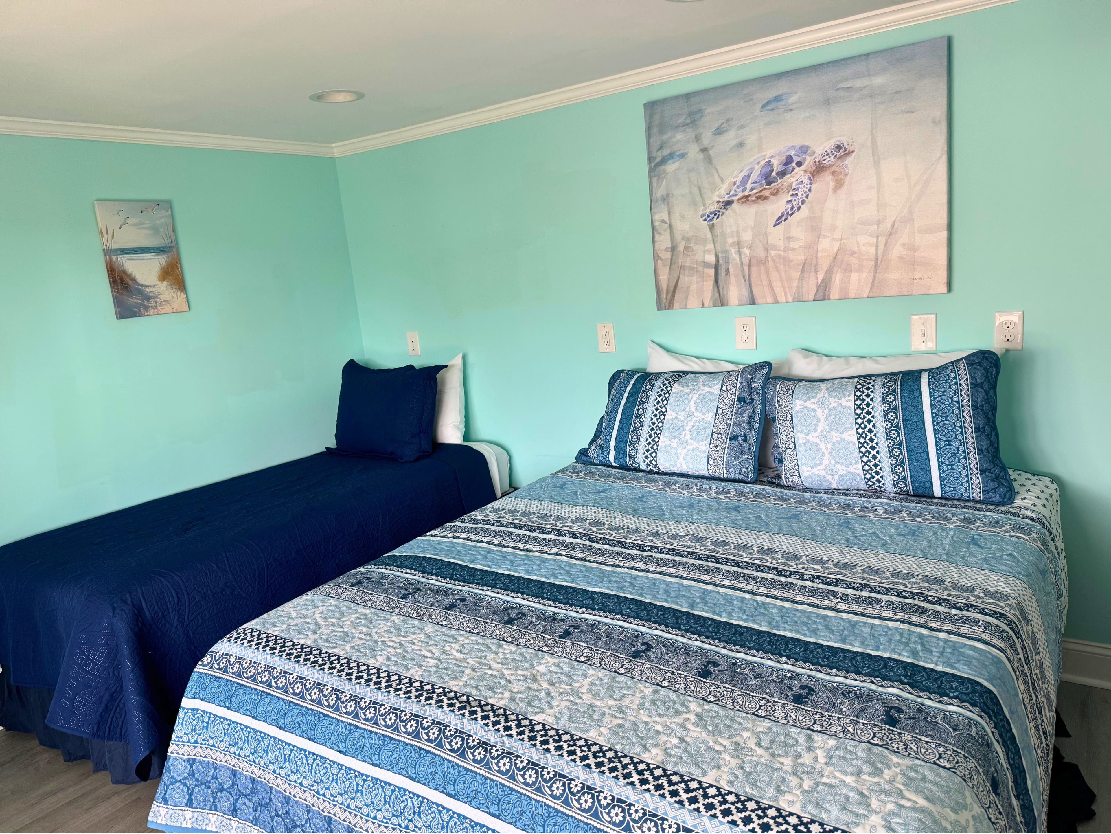 Guest bedroom one with queen bed